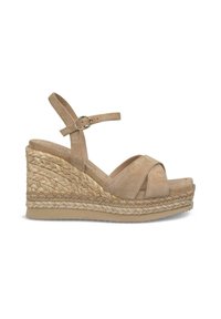 Sandales compensées en suède beige avec un bout ouvert, des lanières croisées et une sangle de cheville réglable. La semelle en jute tissée ajoute de la texture et de la hauteur.