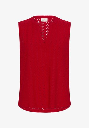Red sleeveless top made of textured fabric with a diamond pattern, featuring a V-neckline and small cut-out details along the hem.