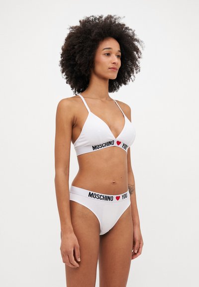 White bikini set with a triangular top and matching low-rise bottoms. Features black "MOSCHINO I ❤️ YOU" text on the elastic bands.