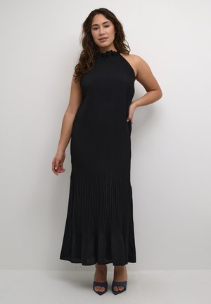 Black, sleeveless dress with a pleated skirt and a ruffled neckline detail. Smooth texture and fitted design extend to floor length.
