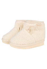 Cremfarbene Hausschuhe mit einer weichen, flauschigen Textur, runder Form und elastischen seitlichen Öffnungen. Sie verfügen über eine einfarbige beigefarbene Sohle und minimale Nähte.