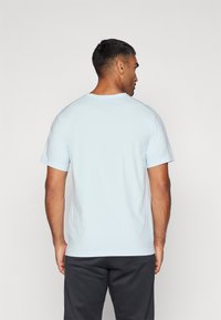 Nike Performance HYVERSE - T-Shirt sport - glacier blue/black