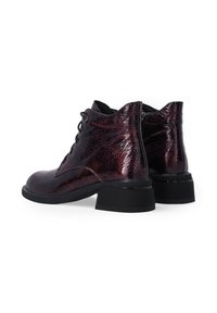 Lace-up ankle boots in dark burgundy glossy leather with a textured finish and a sturdy black heel for added support.