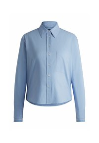 Ljusblå skjorta i knäppmodell gjord av texturerad tyg, med krage, långa ärmar och bröstficka. Utsmyckad med randiga manschetter.