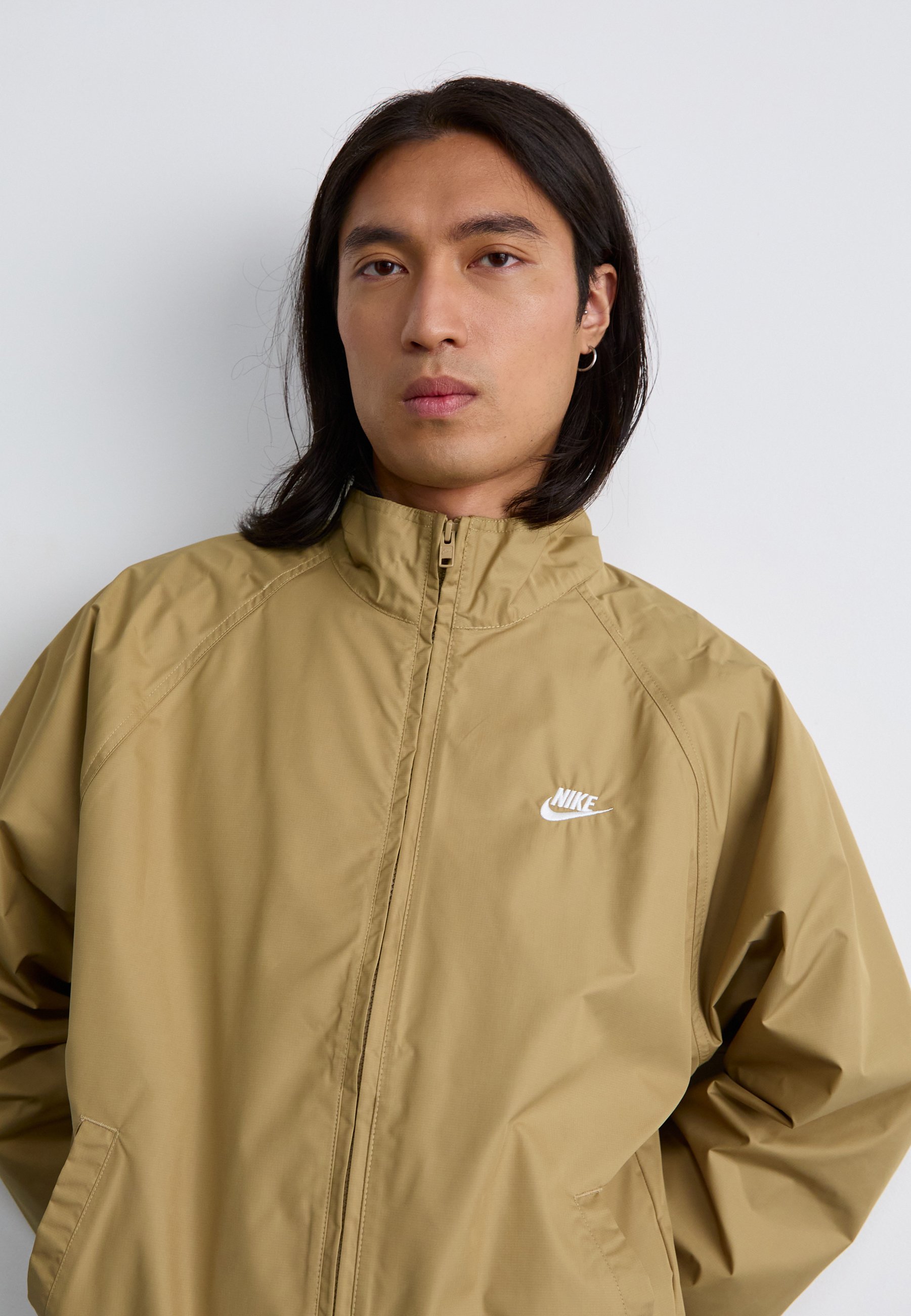 tan and white nike windbreaker