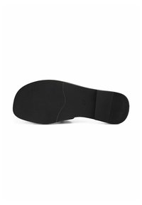 Semelle d'une chaussure noire avec des parties avant et talon texturées séparées par une section centrale lisse, numéro de taille 37 visible au centre.