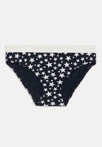 Εσώρουχο από βαμβάκι με ναυτικό φόντο, που διαθέτει λευκά αστεράκια σε όλη την επιφάνεια. Ελαστική ζώνη μέσης με το λογότυπο "TOMMY HILFIGER" σε ανοιχτό γκρι.