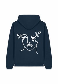 Felpa navy realizzata in tessuto morbido, con un disegno a linea bianca di un volto circondato da foglie attorno agli occhi, in una vestibilità comoda e con cappuccio regolabile.