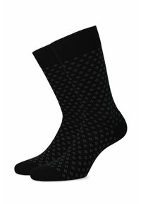 Czarne skarpetki w kropkowany wzór w ciemnoszarych odcieniach. Wykonane z miękkiego materiału, z komfortowym ściągaczem dla lepszej stabilności.
