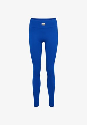 Blaue, nahtlose, hoch taillierte, gerippte Leggings mit einem kleinen weißen rechteckigen Logo-Patch vorne am Bund.