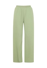 Pantaloni larghi verde chiaro con elastico in vita, caratterizzati da pieghe sottili e una texture morbida, progettati per comfort e libertà di movimento.