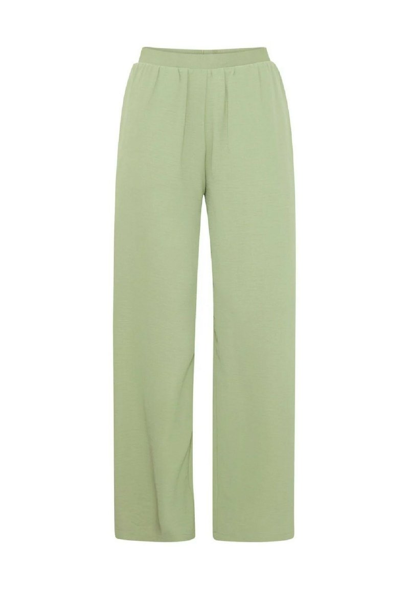 Pantaloni larghi verde chiaro con elastico in vita, caratterizzati da pieghe sottili e una texture morbida, progettati per comfort e libertà di movimento.