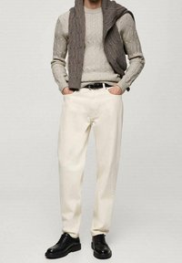 Beige cotton trousers, wool sweater in light gray, textured knit, black leather shoes, casual fit with relaxed silhouette.