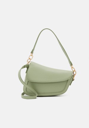 Light green textured leather crossbody bag with flap closure, gold chain links, and adjustable strap on a plain background.