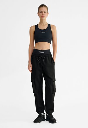 Hummel LOOSE CARGO PANTS - Træningsbukser - black