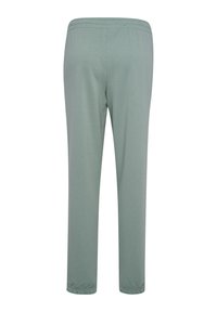 Hellgrüne, leichte Hose mit elastischem Bund und geraden Beinen, aus weichem Stoff, ohne sichtbare Muster oder Akzente.
