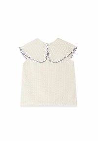Hvid ærmeløs top i et tekstureret stof med en stor scallop-krave kantet med marineblå. Enkel, afslappet form uden lukninger.