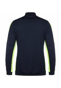 Marineblauw sportshirt met lange mouwen met neon groene zijpanelen, een rechtstaande kraag en een standaard pasvorm. Soepele textuur, typisch voor sportkleding.