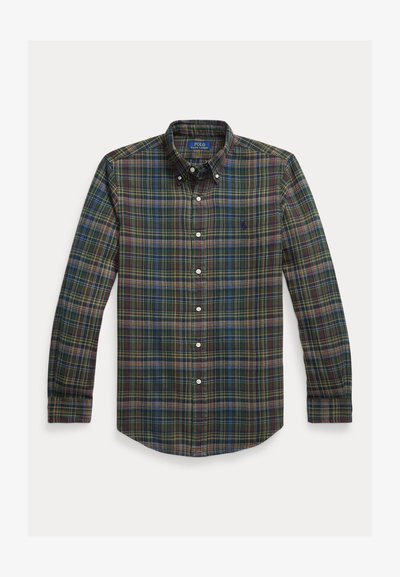 Sakains ar pārslām, garajām piedurknēm, pogu apkakli un pogām priekšā. Zaļas, zilas, sarkanas un dzeltenas krāsas ar teksturētu audumu.