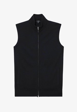 Fekete ujjatlan mellény kötött anyagból, magas gallérral, elülső cipzáras záródással és két oldalzsebbel. Simább textúra és minimalista dizájn.