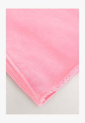 Pink knitted fabric with a smooth texture and ribbed pattern. Edges are neatly stitched with slightly frayed details.