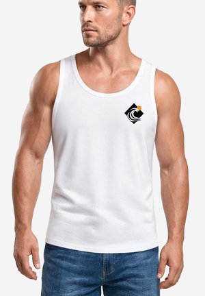 Muscular man wearing a white sleeveless tank top with a small black and orange wave logo on the left chest, paired with blue jeans.