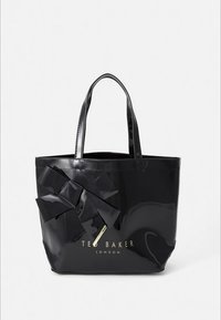 Schwarze Lack-Tasche mit einer großen schwarzen Schleifendetail, glatter Textur und geprägt Logo. Zwei robuste Griffe zum Tragen.