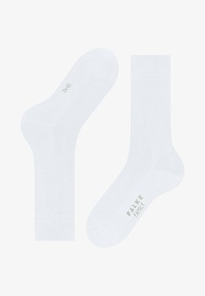 White cotton crew socks with a smooth texture, featuring a reinforced toe and heel. Marked with "FALKE FAMILY" in gray.