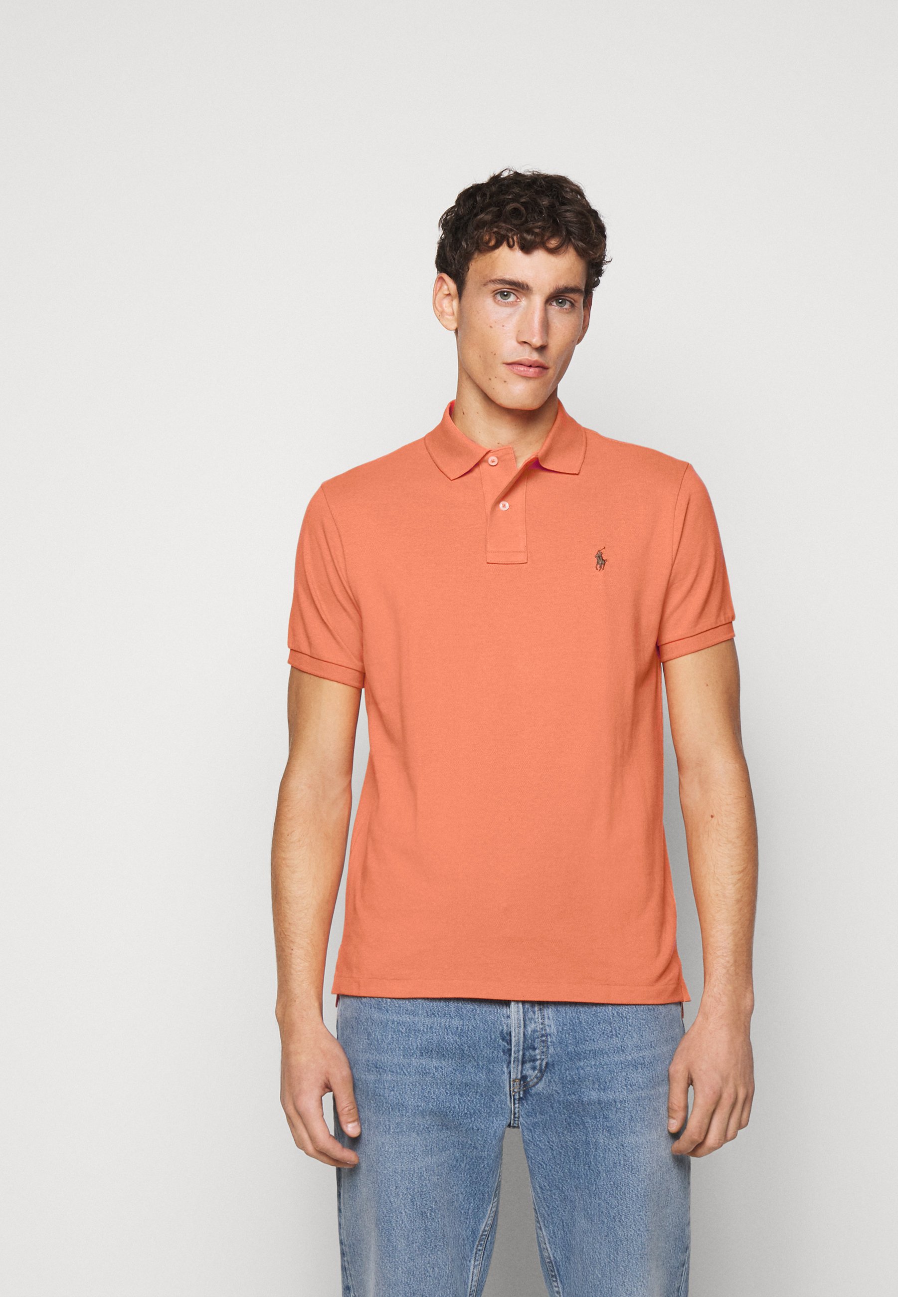 polo asics homme orange