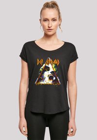 Black T-shirt with short sleeves, featuring a colorful graphic design of a screaming face inside a triangle and "Def Leppard" text.