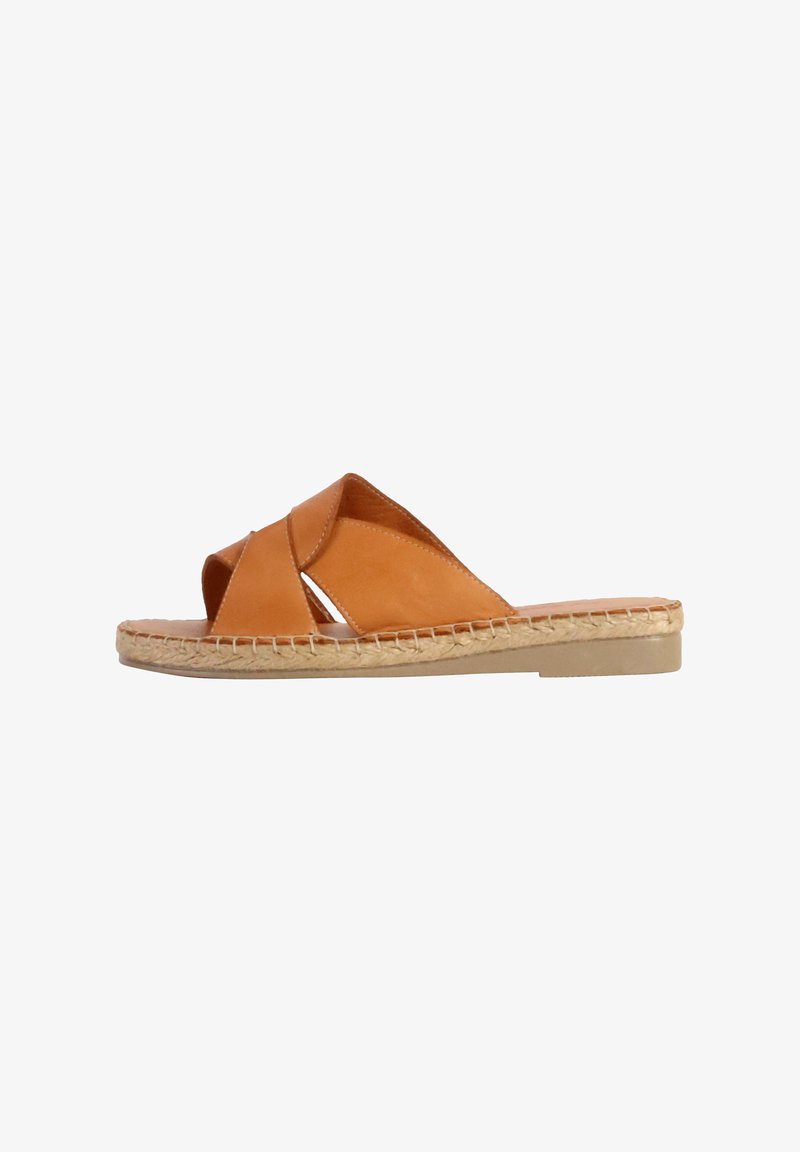Brown leather slide sandal with cross-straps and espadrille-style jute detailing. Flat sole and smooth texture. Casual design.