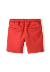 Röda shorts med elastisk midja, utrustade med två bakfickor med blå sömnadsdetaljer. Slät textur, rakklippt design.