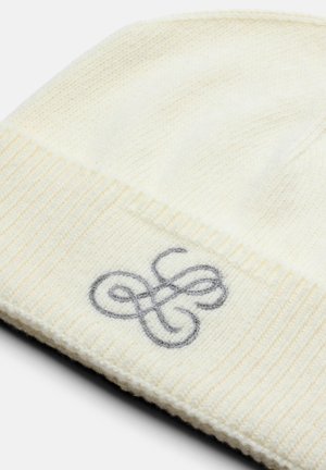 Strickmütze in Creme mit geripptem Saum. Mit einem grauen gestickten Design auf der Vorderseite, aus einer weichen Wollmischung für Wärme und Komfort.