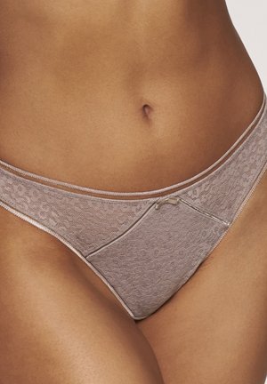 Luxuriöser beiger Spitze-Strings, der ein florales Muster, eine weiche Textur und zarte Verzierungen aufweist. Hoch geschnittenes Design mit einer minimalistischen Form und subtilen Details.