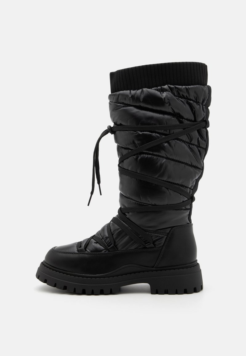 Black thigh-high boots with a puffy, quilted nylon upper and rubber sole. Features a ribbed cuff and crisscross laces for adjustment.