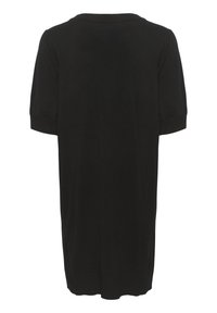 Tunique noire à manches courtes avec un col rond, en tissu doux. Présente une coupe droite et des accents de poignets côtelés.