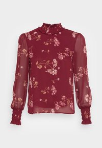 Blusa floreale bordeaux con colletto alto a balze, maniche lunghe in tessuto trasparente e polsini arricciati caratterizzati da motivi floreali in rosa chiaro e beige.