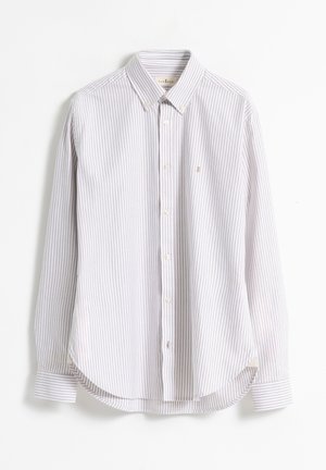 Camisa de botones a rayas en púrpura claro y blanco. Presenta un cuello clásico, mangas largas y dobladillo redondeado. Está hecha de tejido de punto.