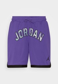 Purple mesh basketball shorts with "JORDAN" in reflective lettering and black accents at the hem. Features an elastic waistband with drawstring.