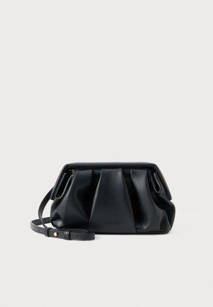 Black leather handbag with a pleated design, a thin adjustable strap, and a top zip closure. Notable texture and soft finish.
