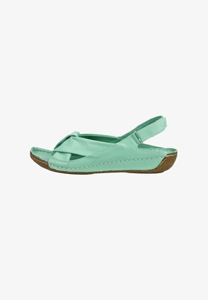 Mintgroene leren open-teen slingback sandaal met gedraaide voorband en bruine gestikte zool, zijaanzicht.