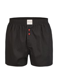 Černé bavlněné boxerky s elastickým pasem, mají přední klopu se třemi červenými knoflíky a malou etiketu na pase.