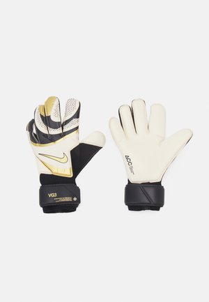 Weiße und schwarze Torwarthandschuhe mit strukturiertem Handflächenmaterial, goldenen Akzenten und elastischen Riemen. Verfügt über verstärkte Nähte und durchbrochene Details.