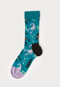 Turquoise socks featuring black and purple crab designs, with a lilac toe and green "happy" text, made from soft knitted material.