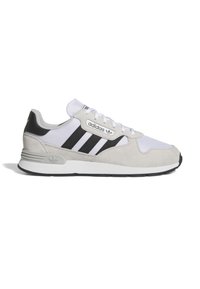 Adidași din suede gri și plasă, cu dungi negre, șireturi albe și un capac gri pentru călcâi cu logo. Design clasic de sneaker.