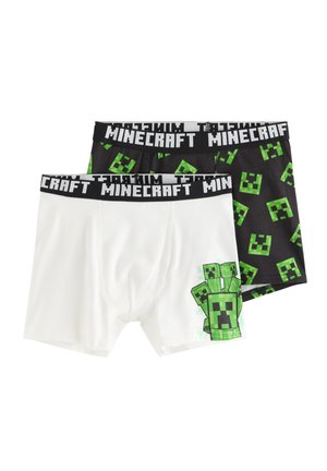 Kaksi paria Minecraft-aiheisia bokserialushousuja, yksi valkoinen vihreällä pikselöidyllä olennon grafiikalla ja yksi musta vihreän pikselöidyn kasvokuvion toistolla.