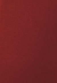 Red cotton fabric with a smooth texture and slight stretch. Even coloration with no visible patterns or accents.