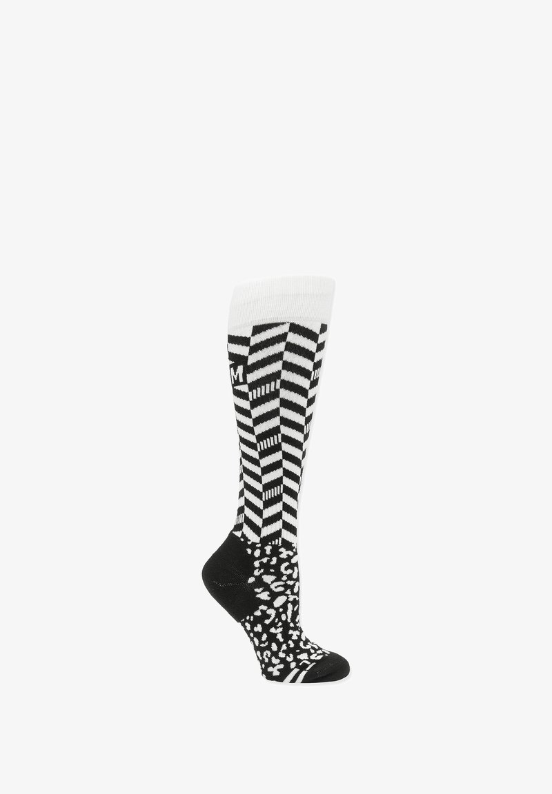 Chaussettes montantes en noir et blanc avec des rayures en zigzag en haut et un motif leopard sur le pied. Texture douce et bord élastique.