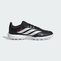 Μαύρο-άσπρο παπούτσι ποδοσφαίρου Adidas Predator με υφή στο πάνω μέρος, κόκκινες λεπτομέρειες, λευκή σόλα και εξογκώματα για επιφάνειες τεχνητού χλοοτάπητα.