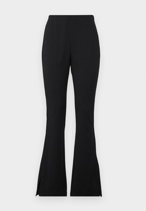 Black flared pants made from a smooth, stretch material. Features side slits at the hem for added detail. Classic design and versatile fit.